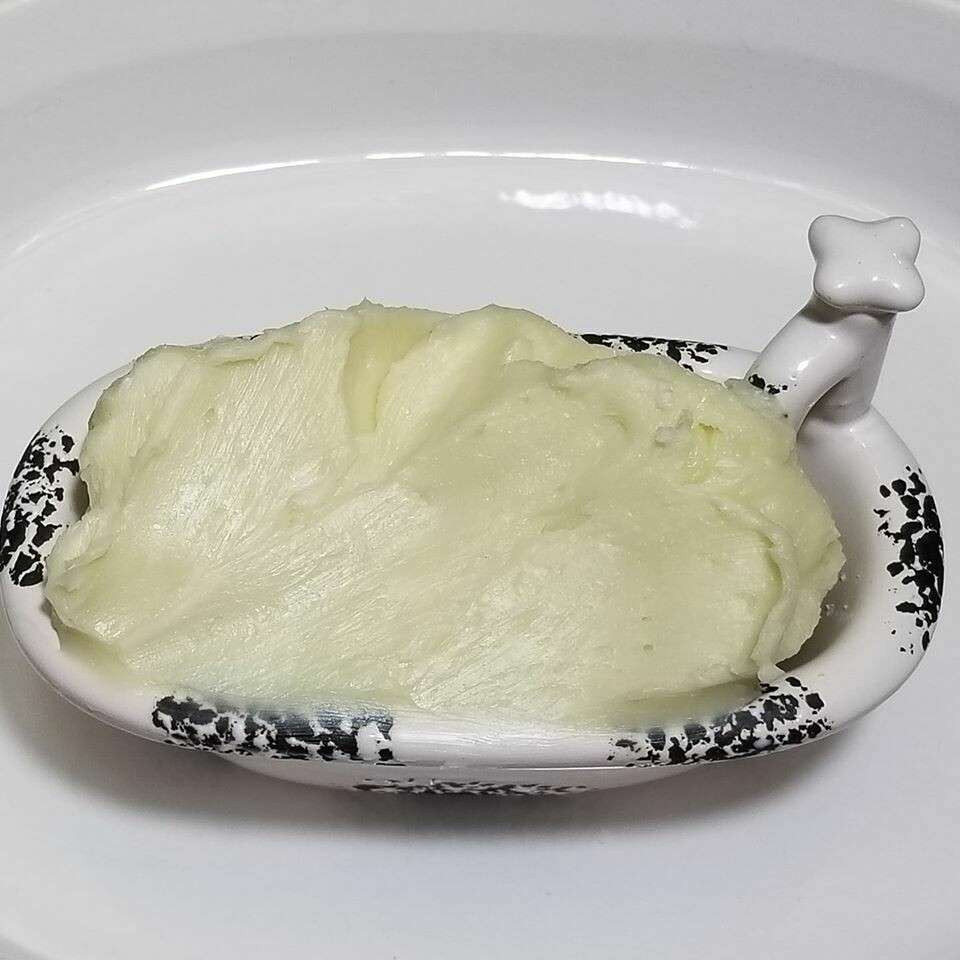 Bowl of light green hemp seed butter
