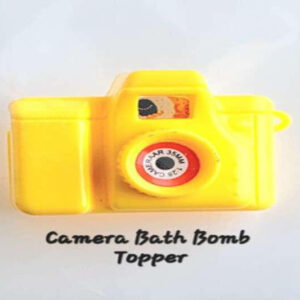 Plastic yellow mini camera bath bomb topper