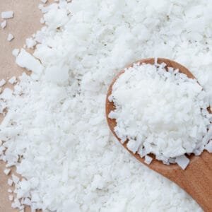Phytomulse Almond Emulsifier flakes in wooden spoon