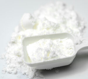 Sodium Lauryl Sulfoacetate SLSA Fine powder in a scoop