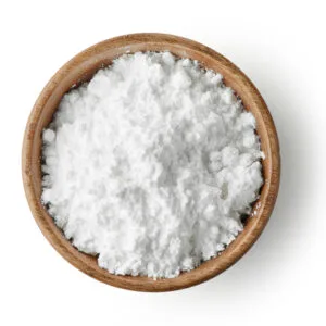 White sodium cocoyl lsethionate (sci) powder in a wooden bowl